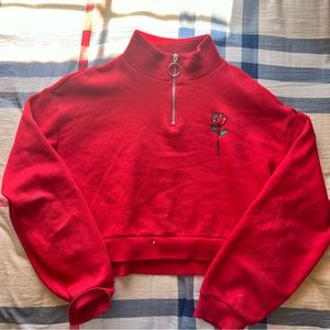 Red half zip sweater with rose print
